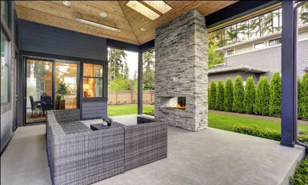 open patio with couches around a fireplace